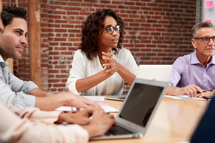 Leaders around conference table