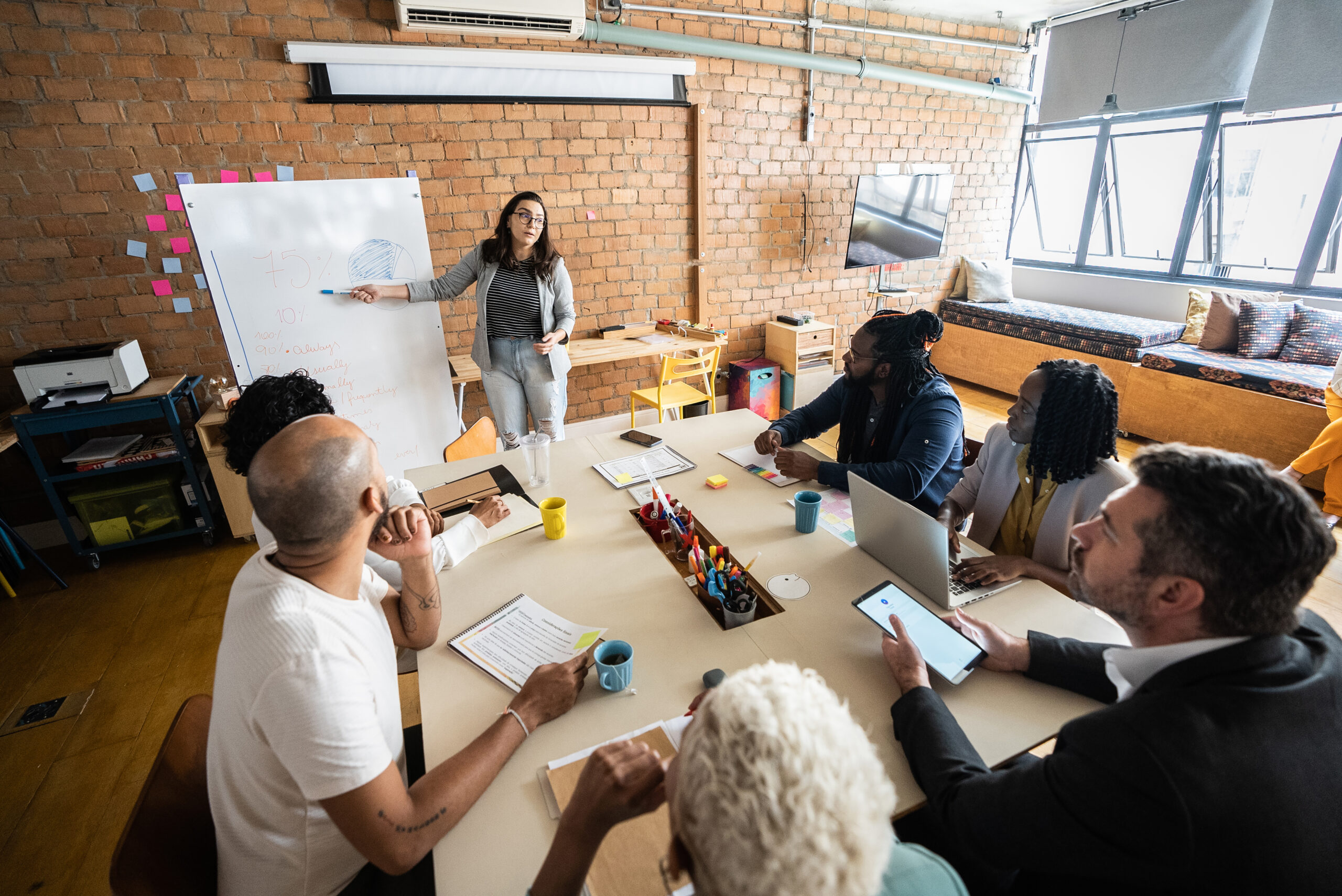 Diverse group of school leaders changing instruction with intentionally thinking about a new curriculum for their district.